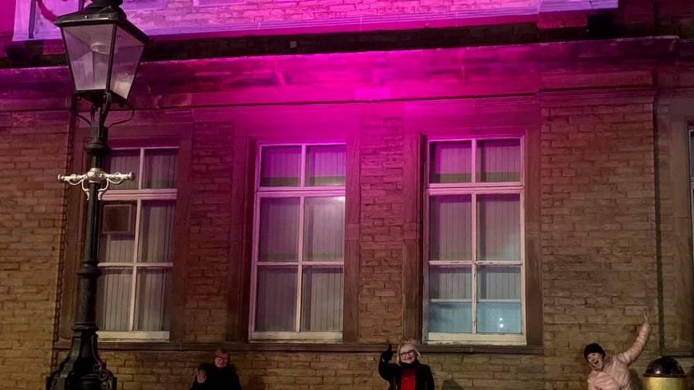 Lighting up Bootle Town Hall (Sefton) Purple for Menopause in the workplace Awareness by Sefton UNISON