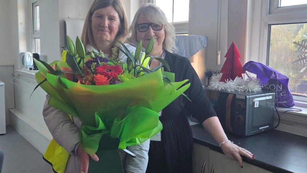 A member called Carol Daly works at Waterloo Primary school received a voucher and a bouquet of flowers from Sefton UNISON .